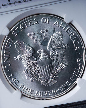 1986 Silver Eagle | MS69 Reverse Struck Thru | John Mercanti Autographed