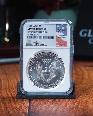 1987 Silver Eagle | MS69 Reverse Struck Thru | John Mercanti Autographed